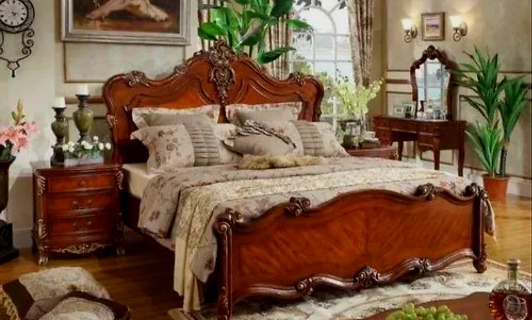 A hand-carved bedroom set made in the Shree Ji Handicrafts workshop
